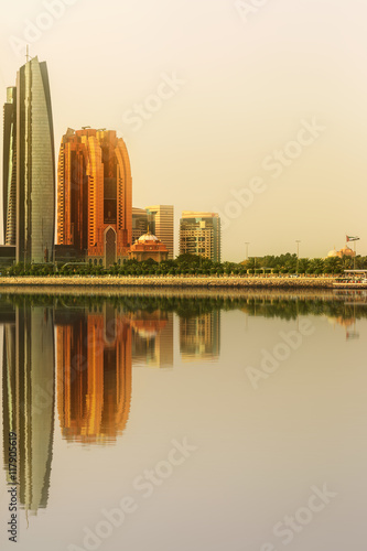 View of Abu Dhabi Skyline and Al Bateen marina at sunset, UAE photo