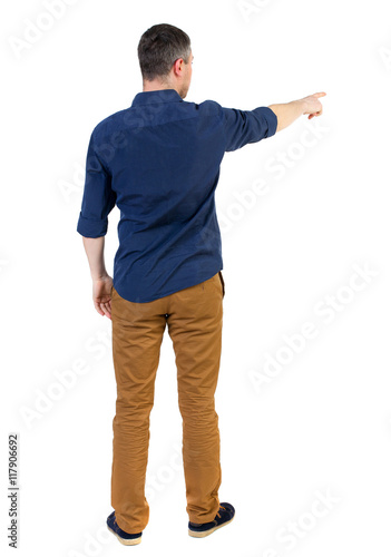 Back view of pointing business man.  Rear view people collection.  backside view of person.  Isolated over white background. a man in a blue shirt with the sleeves rolled up showing the right hand