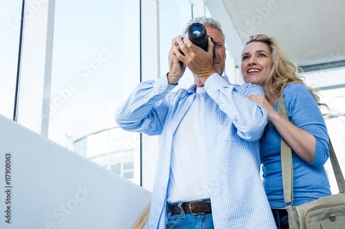 Fotografija Mature couple photographing with camera