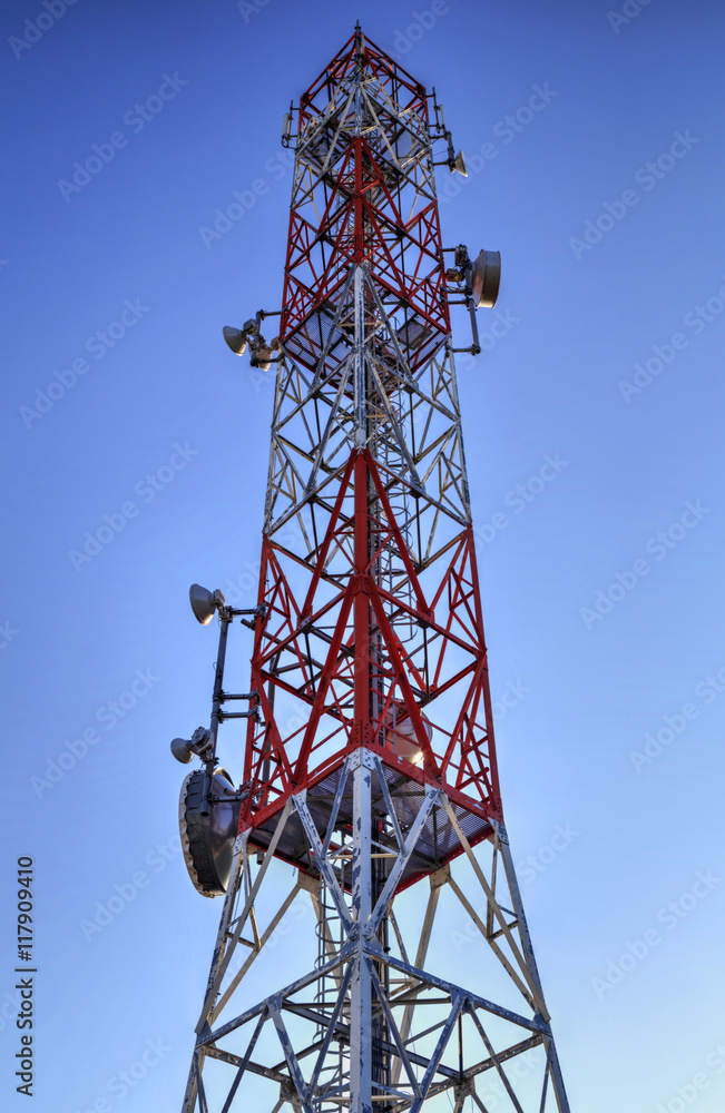Communication antenna tower on blue sky Communication antenna tower on blue sky
