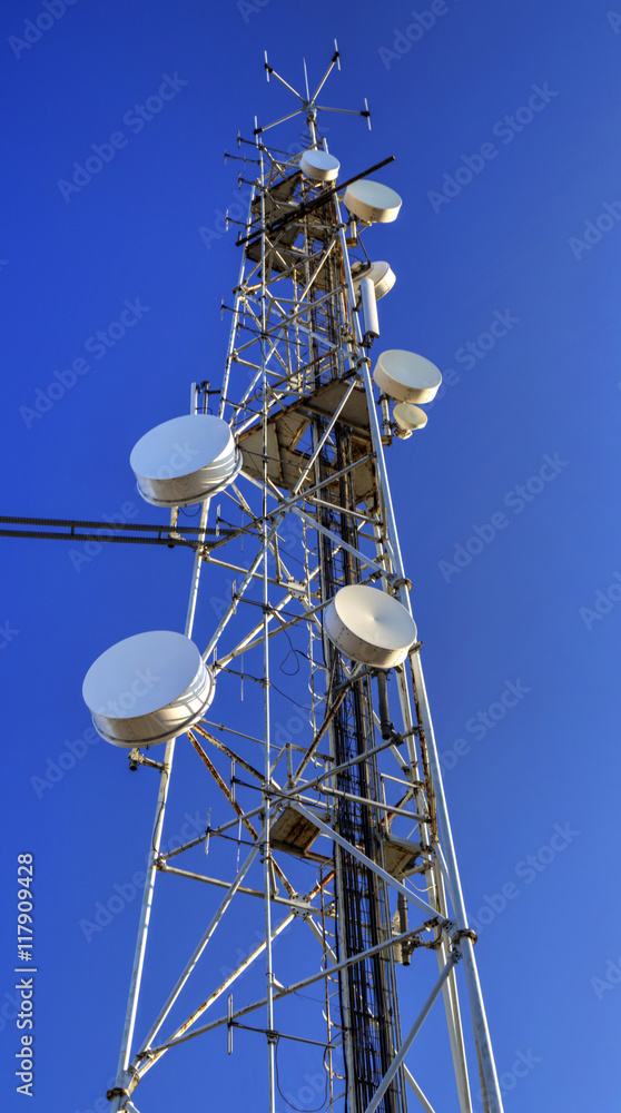Communication antenna tower on blue sky Communication antenna tower on blue sky