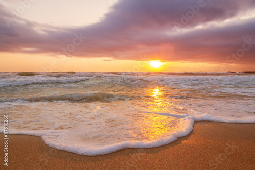 Colorful ocean beach sunrise