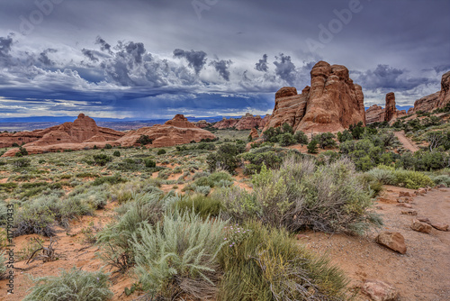 rain on the horizon at Arches National Park.