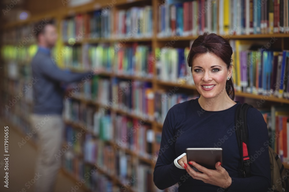 Portrait of mature student holding digital tablet Portrait of mature student holding digital tablet
