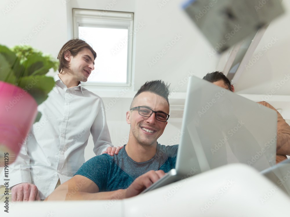 Cheerful coworkers in office during company meeting Cheerful coworkers in office during company meeting