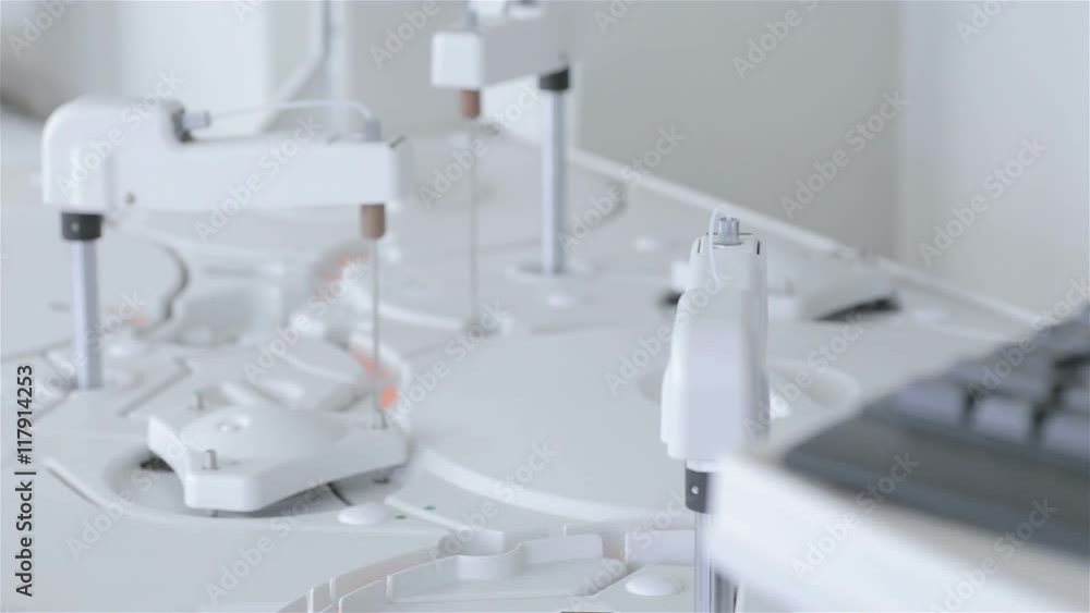 Automated pharmaceutical, medical equipment works in modern laboratory. HD. Automated pharmaceutical, medical equipment works in modern laboratory. HD.