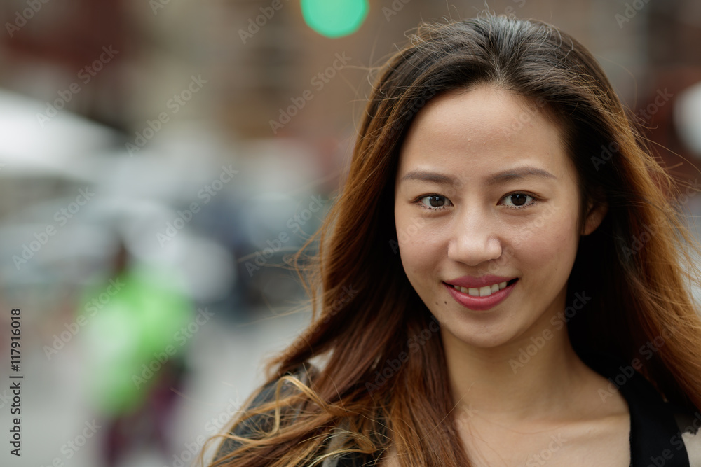Obraz premium Young Asian woman in city walking smile happy face
