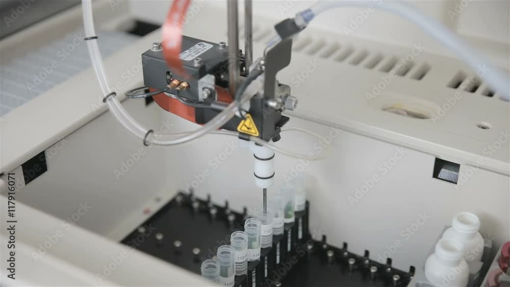 Pharmaceutical automated modern medical equipment working with biomaterial in modern high-tech lab. HD. Pharmaceutical automated modern medical equipment working with biomaterial in modern high-tech lab. HD.