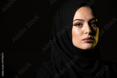 Attractive Muslim Woman On Black Background