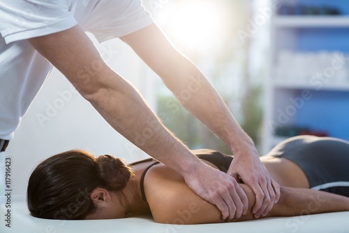 Woman receiving arm massage from physiotherapist