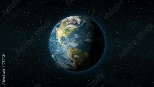 Realistic Earth spinning around its axis, with stars in the background. Seamlessly loopable animation.