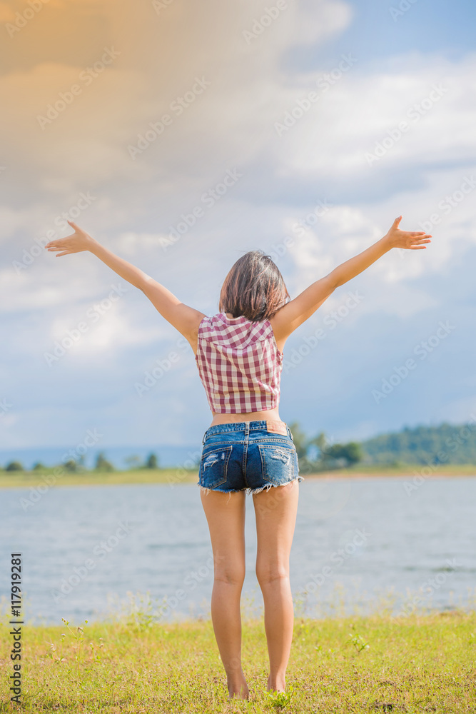 Back view of woman who standing with blue sky Back view of woman who standing with blue sky