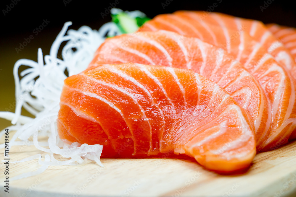 Salmon raw sashimi on wooden table Salmon raw sashimi on wooden table