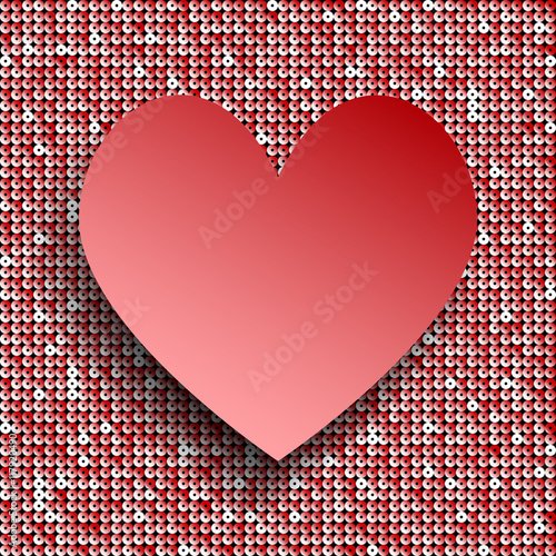 Red heart button on red sequin background.