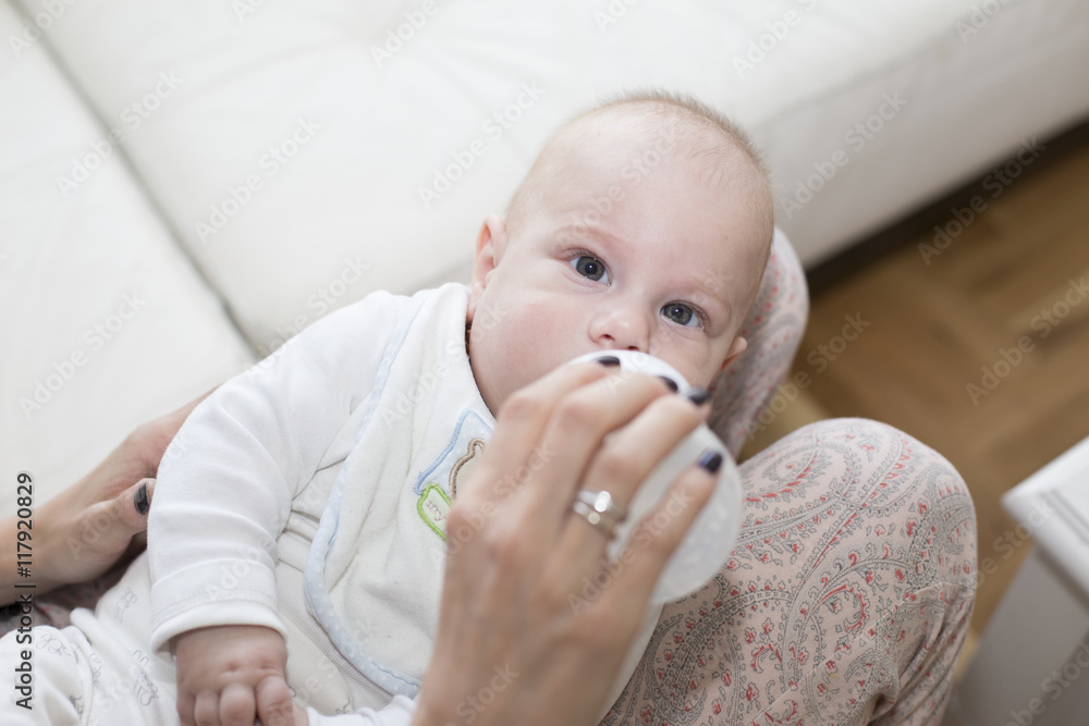 Baby drinking milk from a bottle Baby drinking milk from a bottle