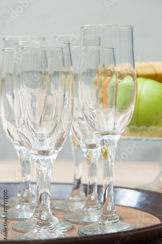 Closeup image of empty stemware standing on a black tray