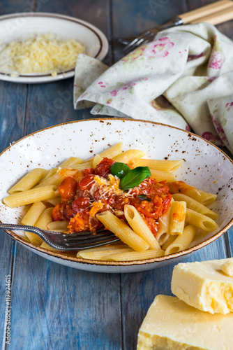 Penne pasta and arrabbiata sauce with cherry tomatoes