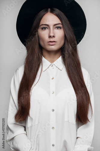 Girl in the hat on a white background