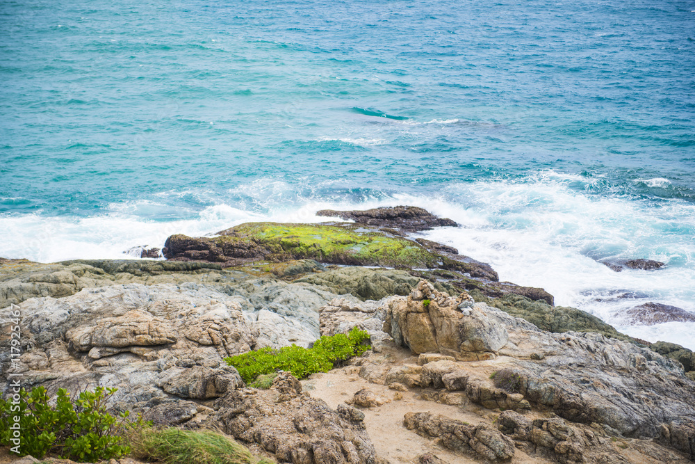 waves lapping against rocks waves lapping against rocks