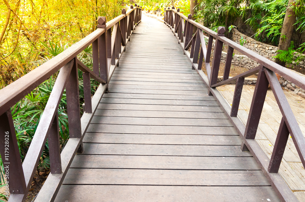 Old charming wooden bridge in park Old charming wooden bridge in park