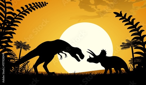 Silhouettes of dinosaurs. Tyrannosaurus and Triceratops on sunset background.