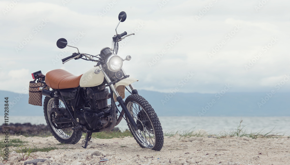 Freedom.Motorbike under sky.Vintage photo effect added for create atmosphere