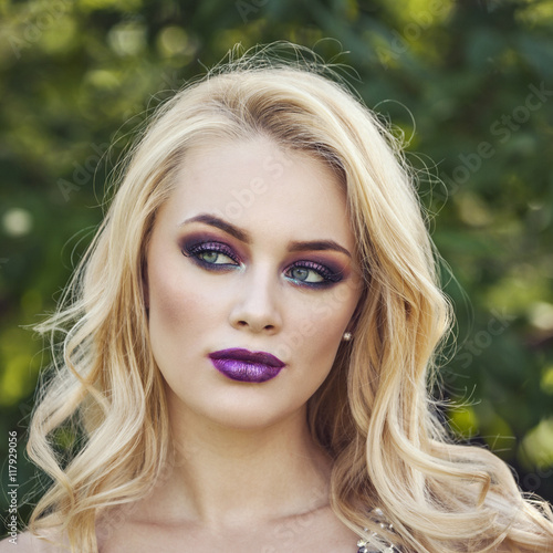 outdoor portrait of fashion young beautiful woman with long blon