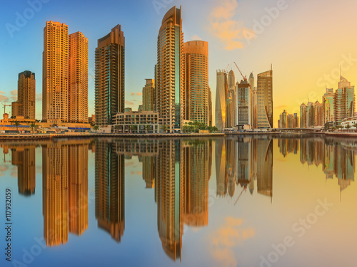 Panoramic view of Dubai Marina bay with yacht and cloudy sky  Dubai  UAE