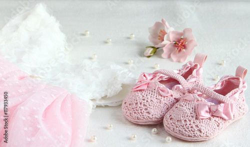 Fototapeta Naklejka Na Ścianę i Meble -  Pink shoes, dress and bandage on his head for a little princess.