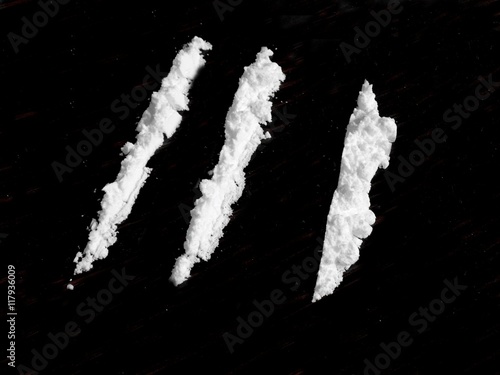 Cocaine drug powder on black background
