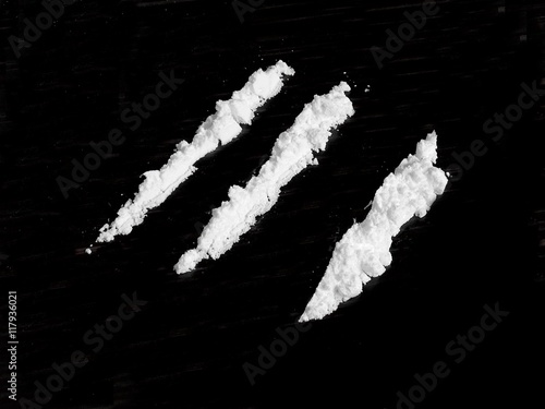 Cocaine drug powder on black background