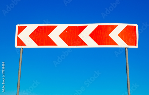 Red traffic sign against a blue sky
