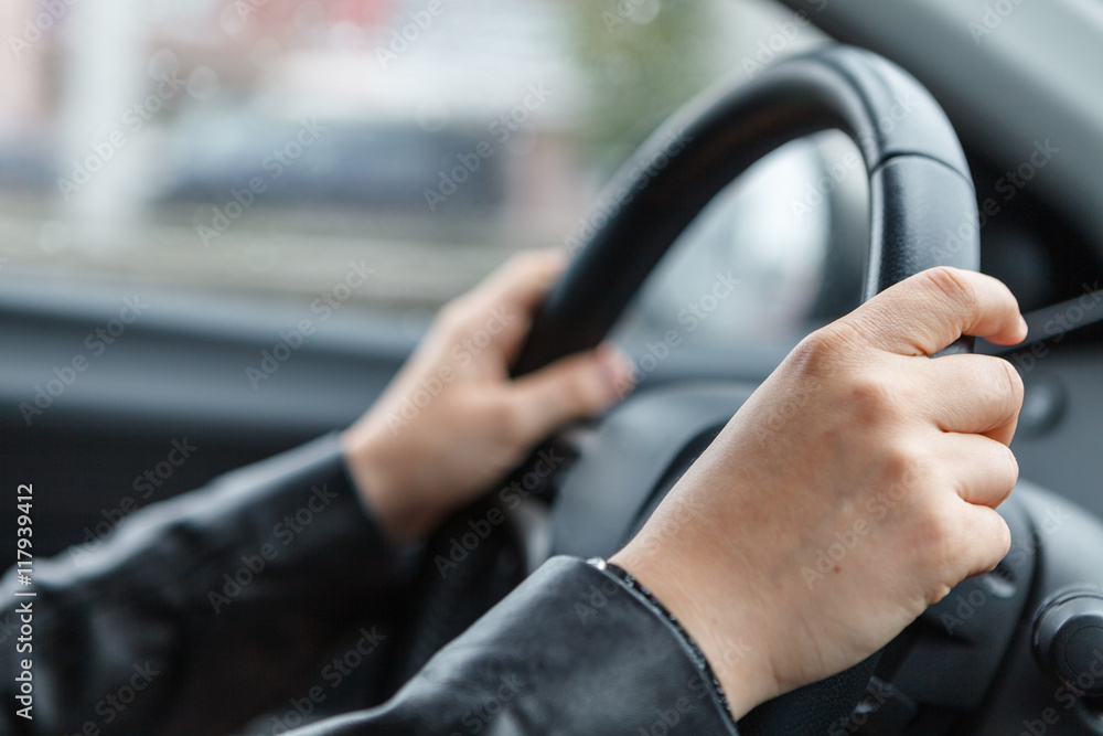 Driving a car, hands on steering wheel Driving a car, hands on steering wheel