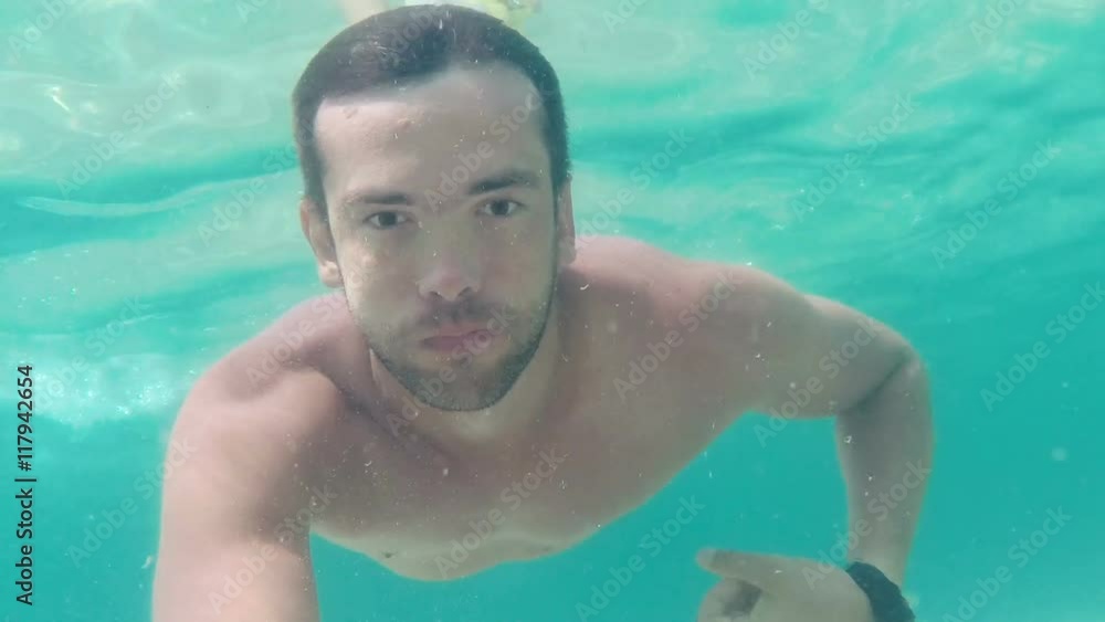 Man diving underwater. Point of view. Man diving underwater. Point of view.