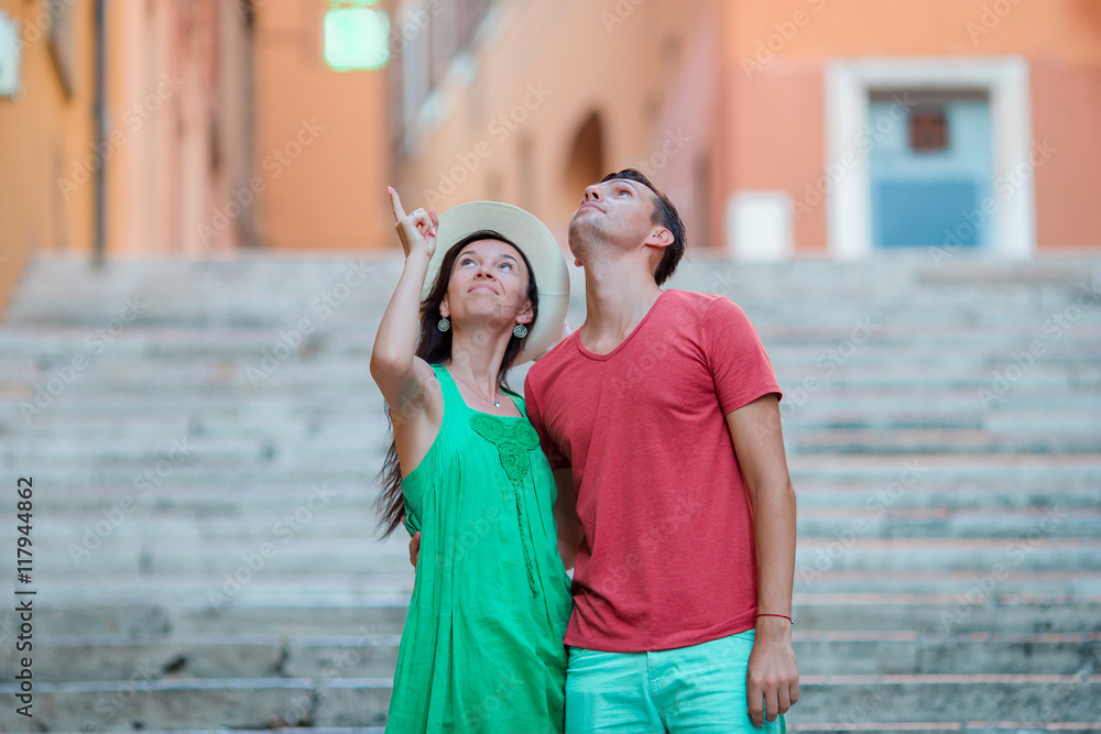 Romantic couple on Steps in Rome enjoy italian holidays. Happy lovers walking on the travel landmark tourist attraction