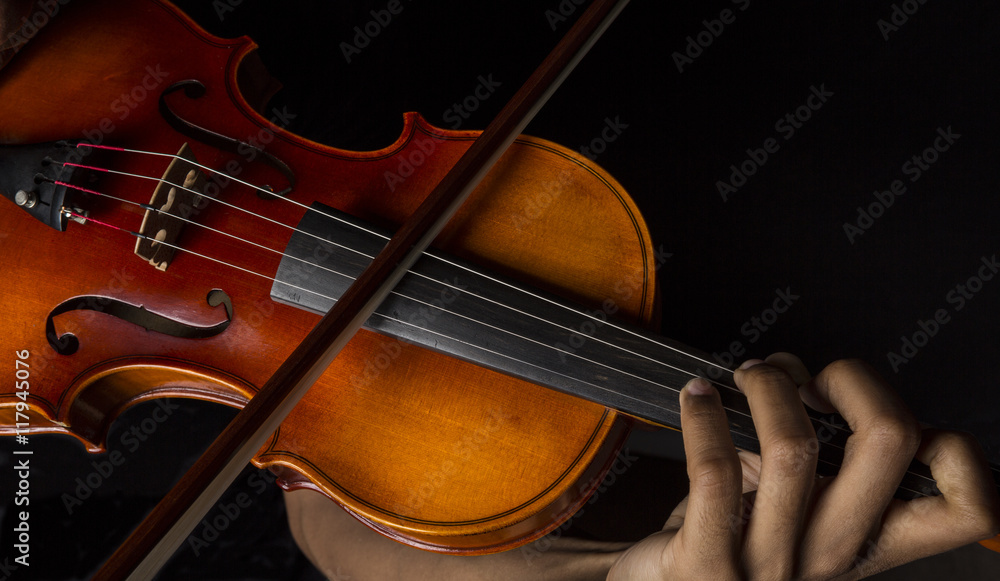 Man playing violin holding the bow Man playing violin holding the bow
