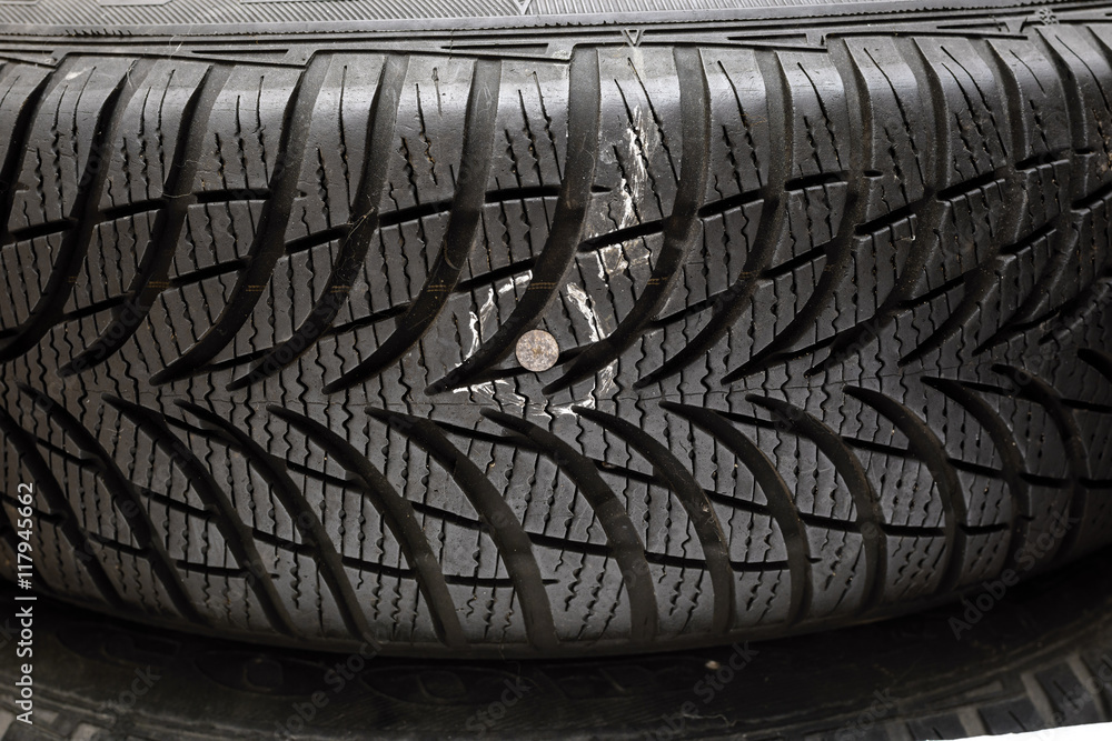 nail-in-tyre-stock-photo-adobe-stock