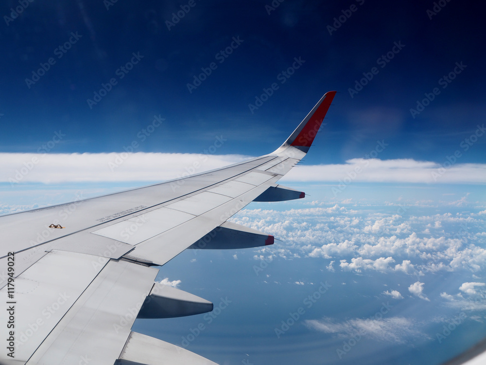 Wing of the plane on blue sky Wing of the plane on blue sky
