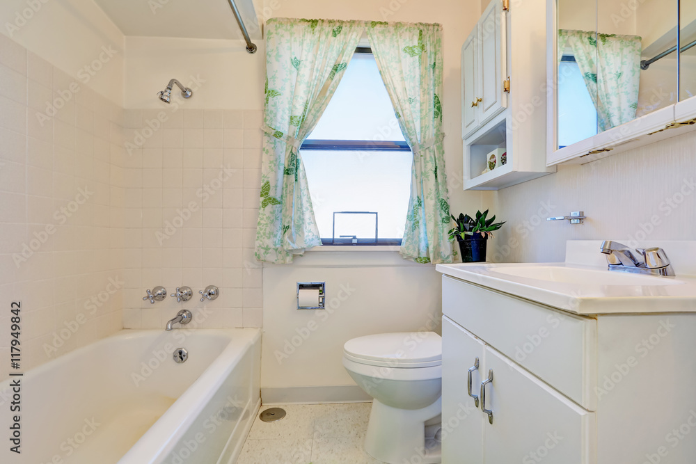 Old style bathroom interior with white cabinets Old style bathroom interior with white cabinets
