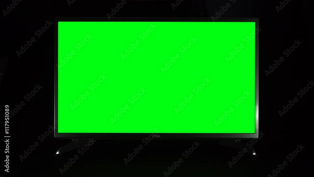 Modern TV with green screen on black background
Modern TV with green screen on black background