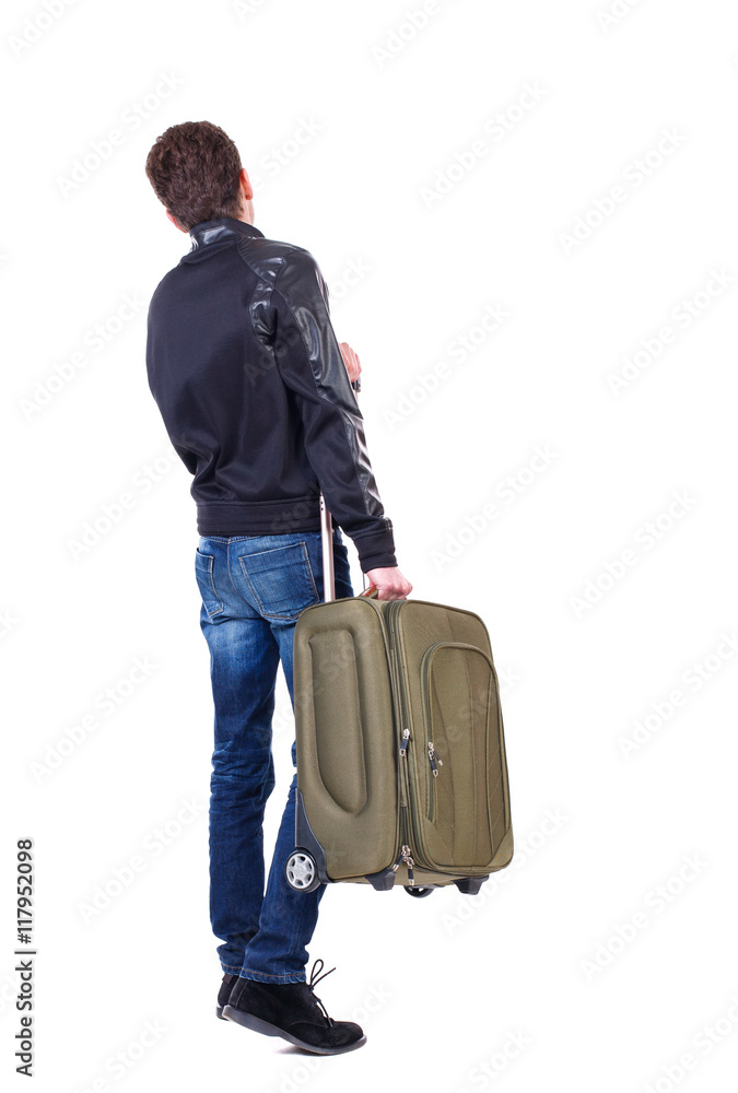 Back view of man with green suitcase looking up. Rear view people collection. backside view of person. Isolated over white background. The traveler carries a suitcase. Back view of man with green suitcase looking up. Rear view people collection. backside view of person. Isolated over white background. The traveler carries a suitcase.