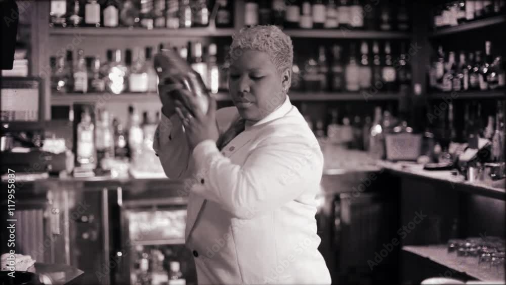 female cocktail waiter in classic cocktail bar female cocktail waiter in classic cocktail bar