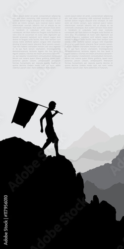 Man with flag standing on top of the mountain