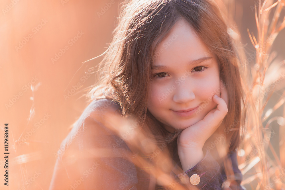 Beautiful young girl smiling at the camera Beautiful young girl smiling at the camera