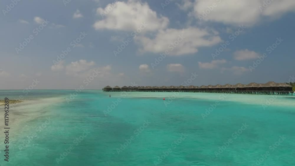 bungalow huts in sea on tropical resort beach bungalow huts in sea on tropical resort beach