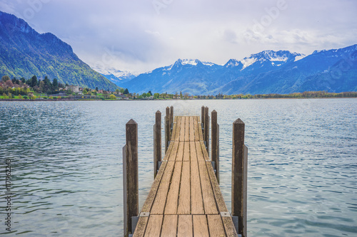 Tranquil scene with wooden pier at lake Geneva in  Montreux, Swi