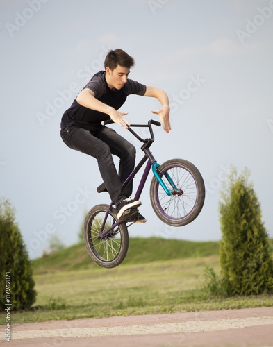 teenager on a bicycle © Chepko Danil