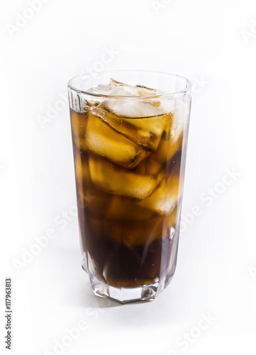 A glass of cold drink with ice on a white background