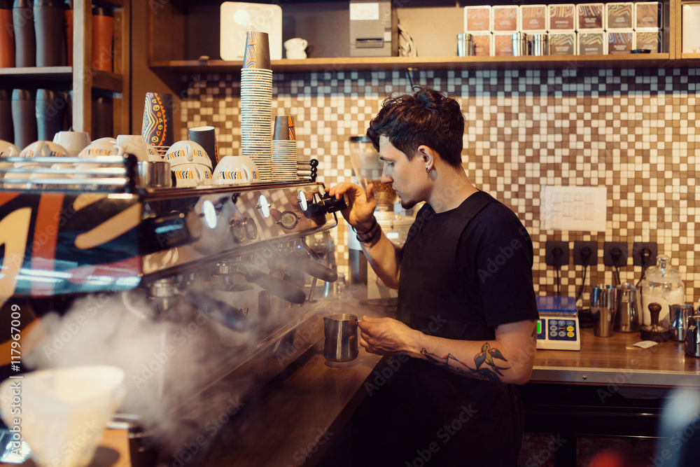 Barista at work in a coffee shop Barista at work in a coffee shop