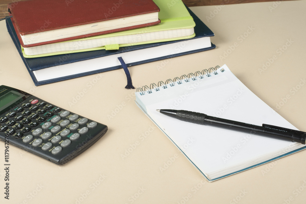 Home savings, budget concept. Chart, notepad, pen, calculator and coins on wooden office desk table. Home savings, budget concept. Chart, notepad, pen, calculator and coins on wooden office desk table.